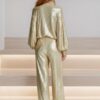 New fashionable party women's wear set: gold sequined jacket with half-zip and wide-leg trousers