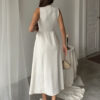 Solid-color sleeveless belt-embellished pearl-buttoned slim-fit slit professional dress